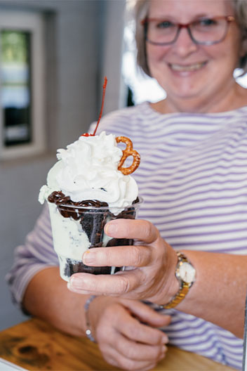 Woman enjoying ice cream sundae